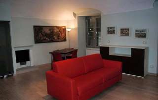 progetto restyling monolocale zona pranzo divano